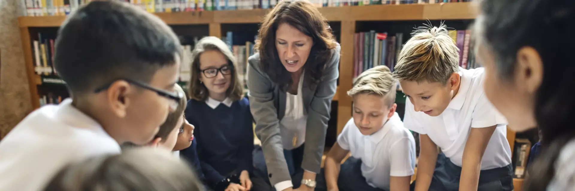 teacher talking to pupils