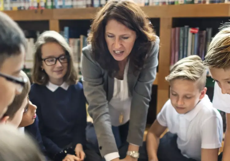 teacher talking to pupils